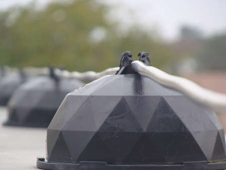 Lightning conductor on the top of the house roof..の写真素材