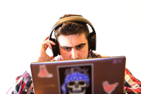 young boy playing computer gamesの写真素材