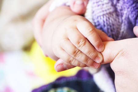 feeling baby mom s handの写真素材