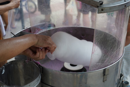 Cotton candy making process in the market.