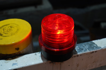Red warning light glowing at a construction site.