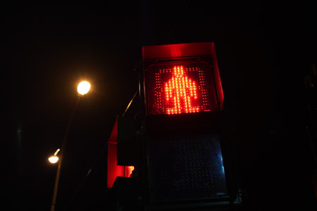 Red Don't Walk pedestrian traffic light in Taipei at night.