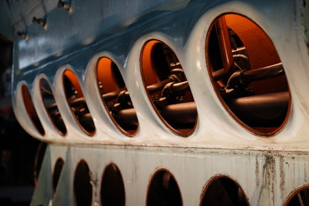 Close-up of illuminated openings in a row on a vintage diesel engine.の写真素材