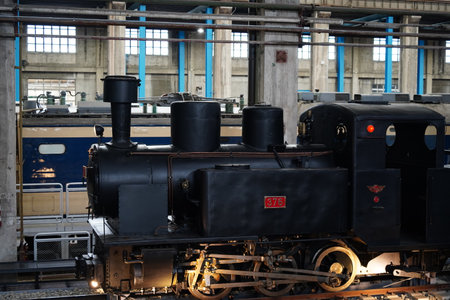 Side view of the vintage steam locomotive in a museum.の写真素材