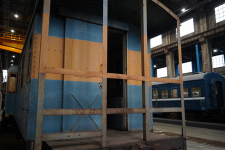 A view of a vintage, weathered Express passenger train car in a museum.