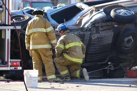 Car accident with emergency people investigating the scene