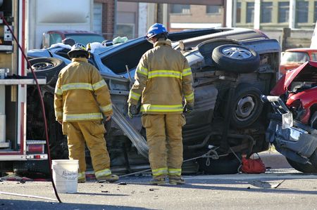 Car accident with emergency people investigating the sceneの写真素材