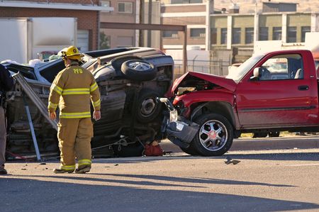 Car accident with emergency people investigating the sceneの写真素材