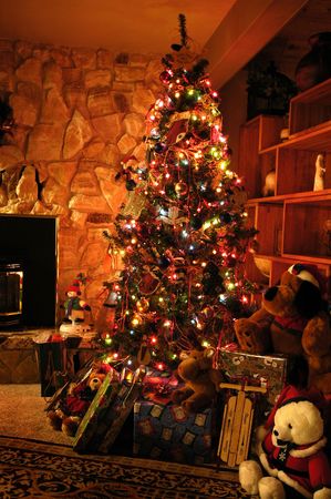 Front room decorated for christmas with christmas tree stockings and fireplaceの写真素材