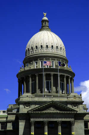 State capital building with flags and skyの写真素材