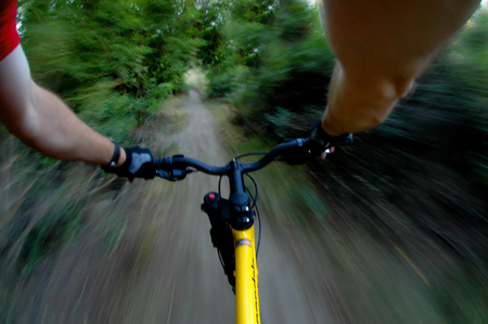 Mountain biking up a trail in the mountains