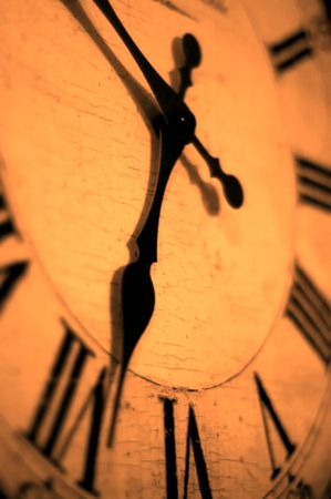 Detail of clock face with numbers and hands showing timeの写真素材