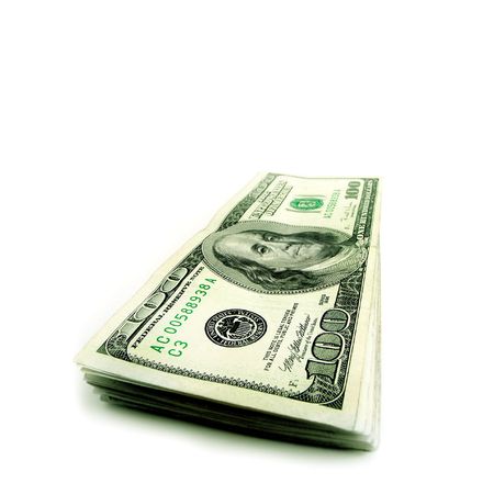 Closeup of stack of hundred dollar bills isolated on white background