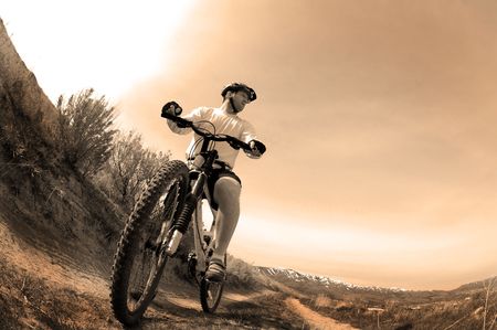 Mountain biking up a trail in the mountains