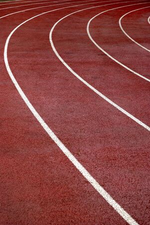 Lanes of a race track with a curve at the end