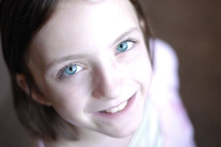 Portrait of young little girl with focus on eyesの写真素材