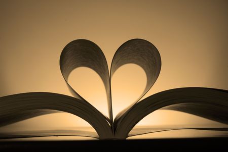 Book with pages turned into the shape of a heartの写真素材