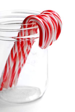 Closeup of isolated candy canes in a jarの写真素材