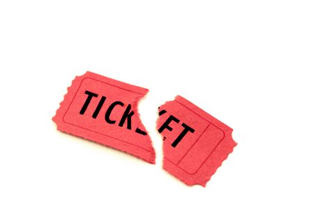 Single torn red ticket for admission to an event の写真素材