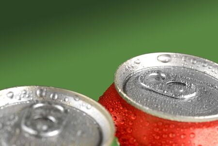 Closeup of soda or pop cans with drops of water for fresshness