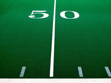Fifty 50 yard line on football field                の写真素材