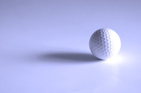 Closeup of golfball with dark shadows の写真素材