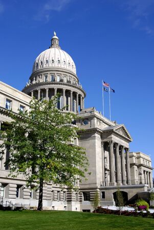 State capital building with flags and skyの写真素材
