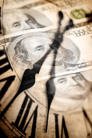 Claick with hundred dollar bills in the backgroundの写真素材