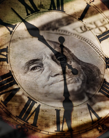 Detail of clock face with numbers and hands showing time