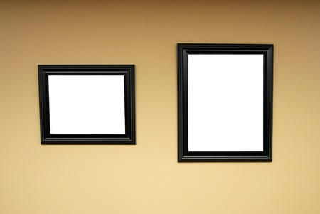 Two blank wooden black frames on wall waiting for artの写真素材