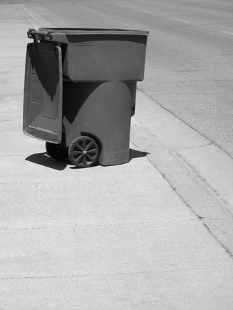 Garbage can on street illustrating pollution and recyclingの写真素材
