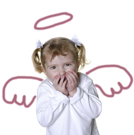 Little girl angel with funny expression on her faceの写真素材