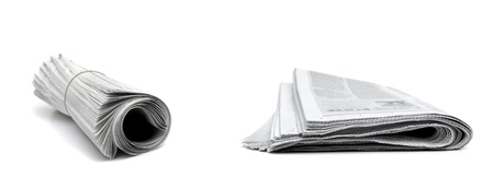 Rolled up newspapers isolated on white backgroundの写真素材