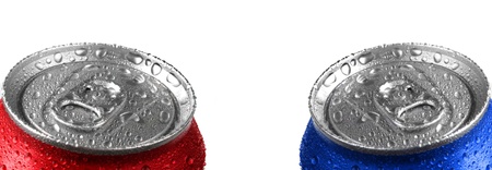 Fresh cans of soda with water drops and red color on white backgroundの写真素材