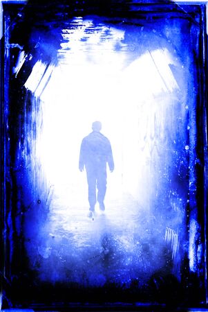 Long tunnel walkway with person at the endの写真素材
