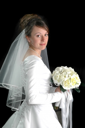 Portrait of Bride in Wedding Dress with bridal veil on black backgroundの写真素材
