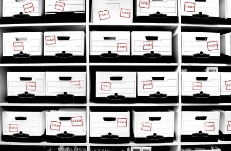 Office shelves full of boxes of tax documentsの写真素材