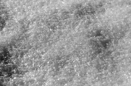 Snow with patterns of shadows and fresh ice crystalsの写真素材