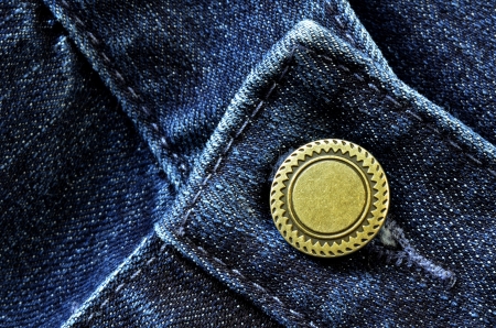 Denim pants with detail of brass button and seamsの写真素材