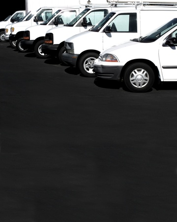 White cars in a row in a parking lot or car lotの写真素材