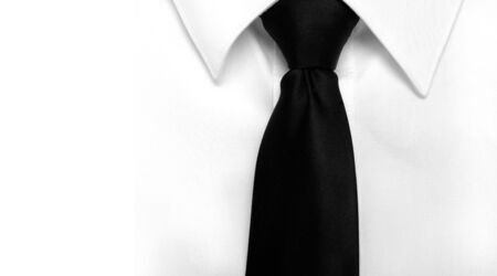Closeup of white shirt and black tie with copy spaceの写真素材