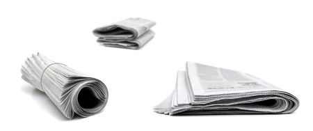 Several newspapers isolated on white backgroundの写真素材