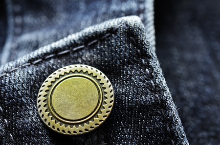 Denim pants with detail of brass button and seamsの写真素材
