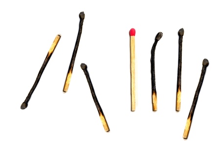 Group of Matches with several burned and one not yet litの写真素材