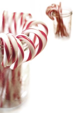 Closeup of isolated candy canes in a jarの写真素材
