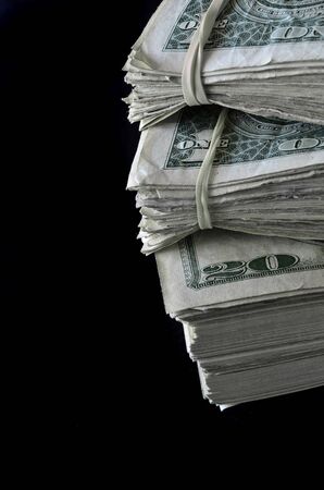 Closeup of stacks of American money or bills in a pileの写真素材