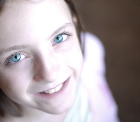 Portrait of young little girl with focus on eyesの写真素材