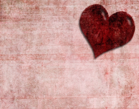 Single paper heart on red textured backgroundの写真素材