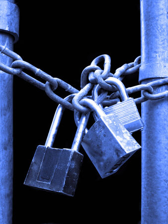 Several Locks and chain on fence gate for securityの写真素材