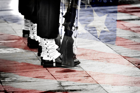 Row of soldiers drilling and marching with American Flag の写真素材